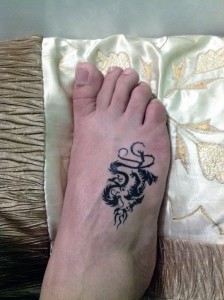 small dragon tattoo on foot