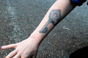 Forearm key tattoo