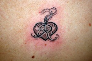 Tattoo of Double AR heart Union bond tattoo  custom tattoo designs on  TattooTribescom