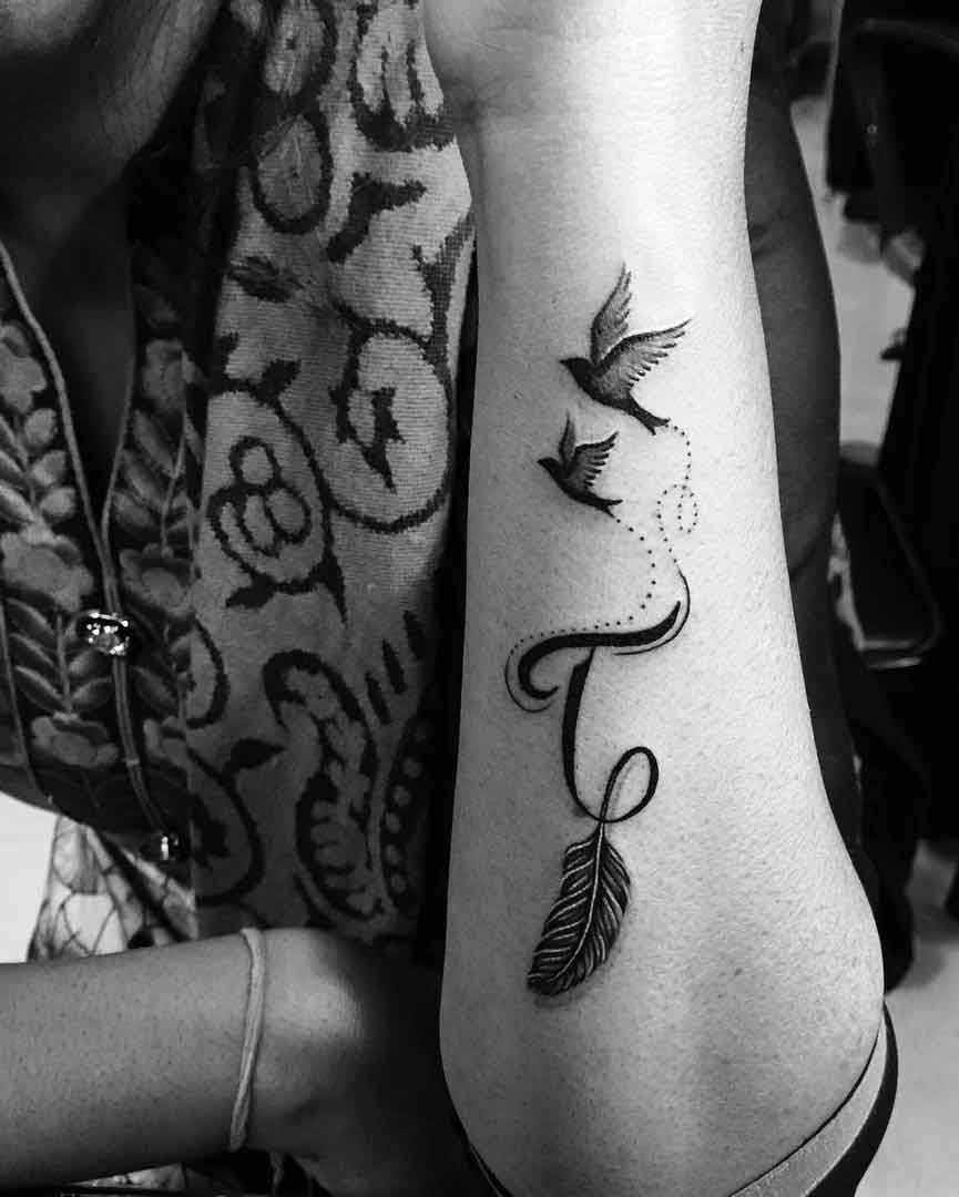 Simple dove w/ a custom script letter “T”✍🏾✨ • • • • • #inkedbydannyy_ # tattoo #tattoos #tattooideas #tattoodesign #tattooartist… | Instagram