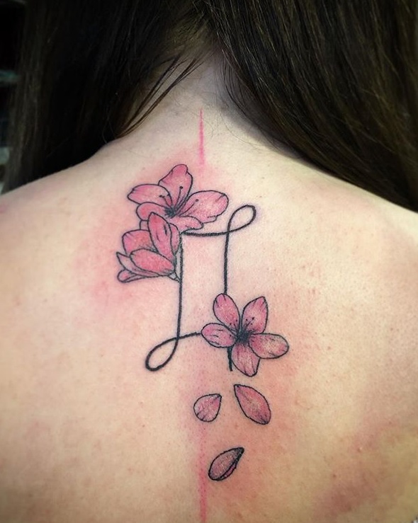 Pink Flowers And Gemini Zodiac Tattoo Design