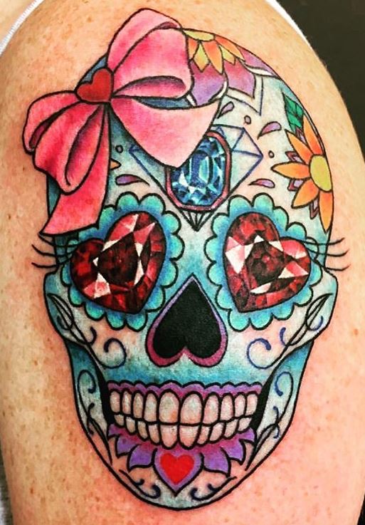 Grey sugar skull with colorful flowers tattoo on thigh for women