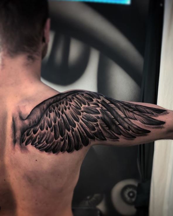 angel wings tattoo on shoulder blade