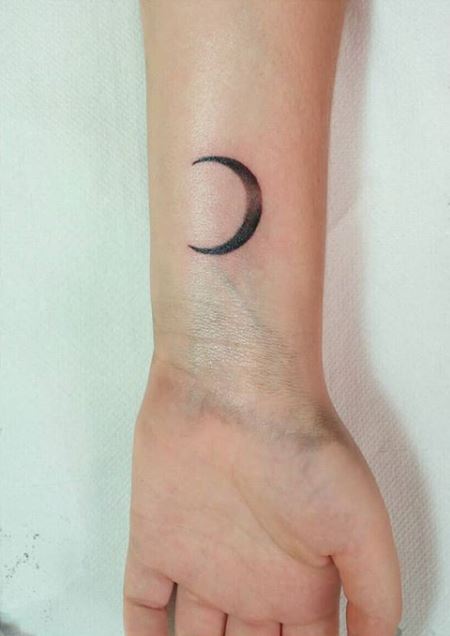 Crescent moon tattoo on the shoulder