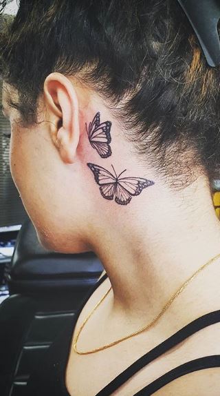 Fine line micro butterflies tattoo on the foot