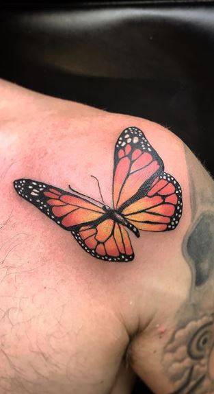 Small butterfly couple tattoo on the left shoulder