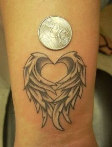 locked heart with wings tattoo