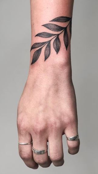 Black Ink Small Flower Vine Tattoo On Women Wrist – Truetattoos