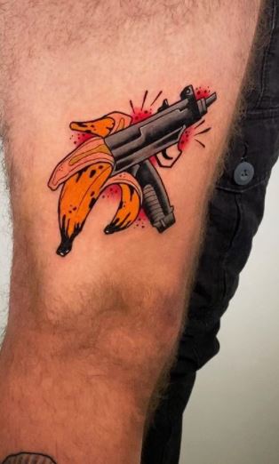 Winged Pistol Tattoo Design Idea