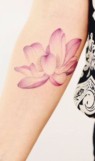 Lotus flower tattoo symbolizing strength of overcoming struggle,  symbolizing new beginnings | Flower wrist tattoos, Colorful flower tattoo, Flower  tattoo arm