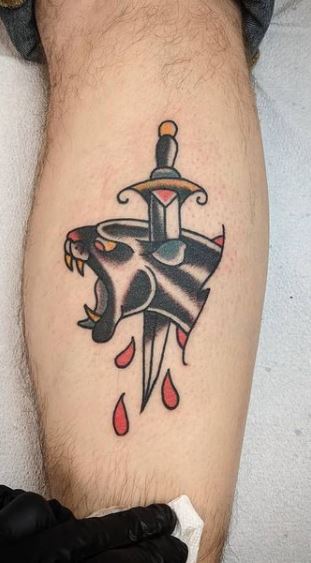 panther head dagger tattoo