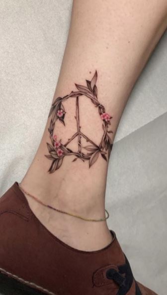 Peace Symbol tattoo floral by Kyle Grover TattooNOW