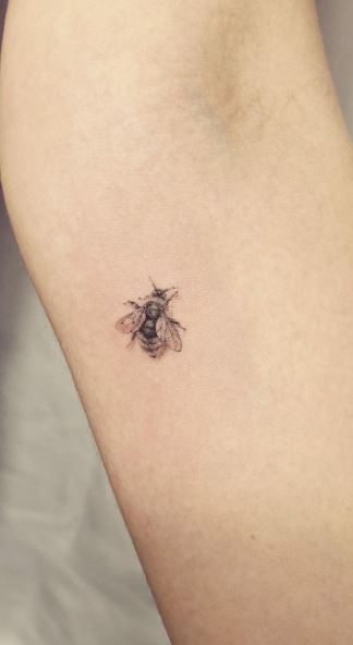 Simple bee tattoo on the wrist  Tattoogridnet