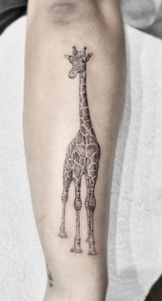 Giraffe tattoo on the left thigh  Tattoogridnet