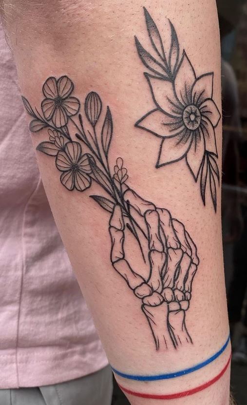 Skeleton Hand holding a Daffodil by Curt Montgomery  Holy Noir Tattoo  Toronto Done February 2018  rtattoos